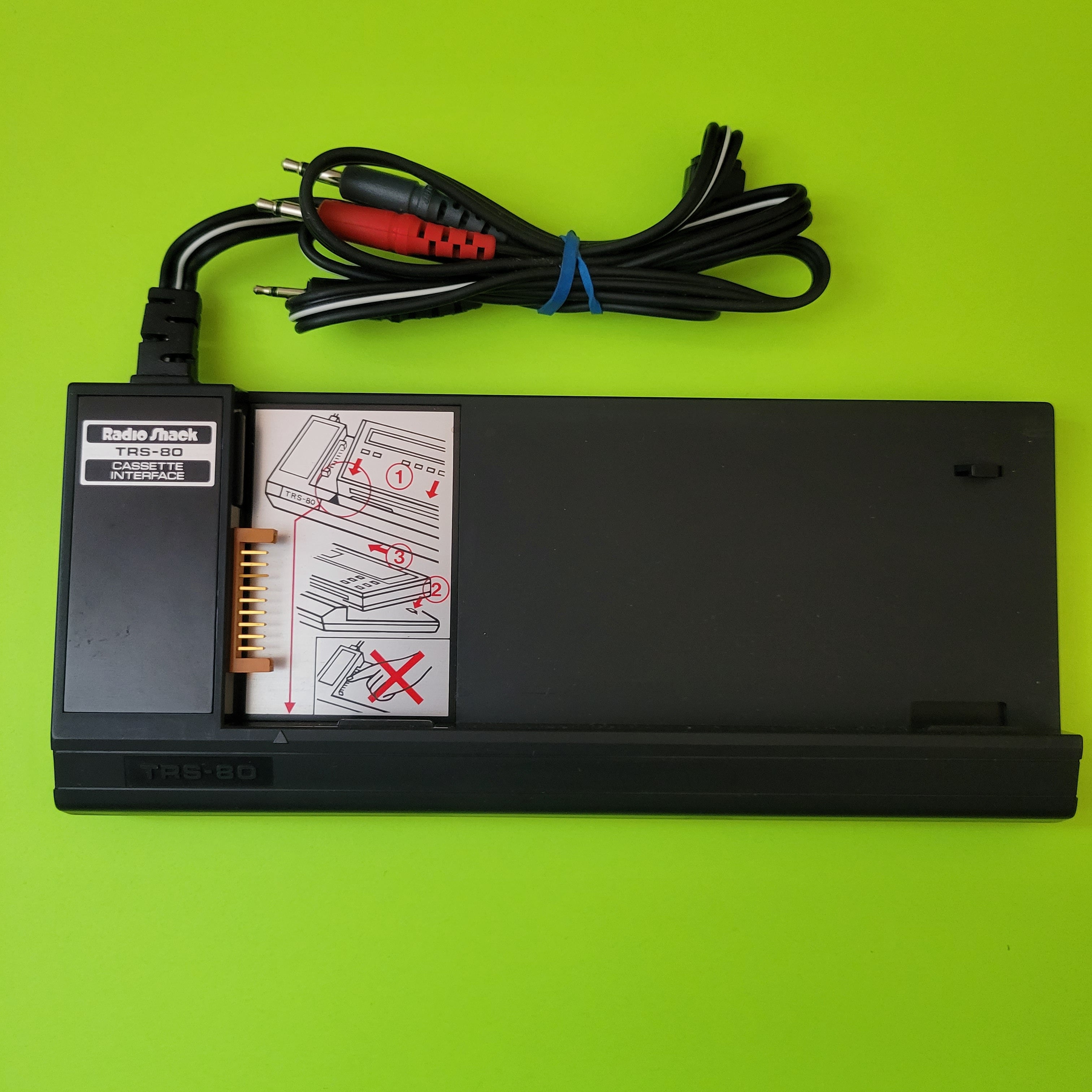 An image of the front of a Radio Shack TRS-80 PC-1 cassette interface
